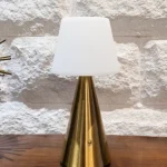 Neje Lighting | Aria : Sculptural Minimalism for Modern Luxury Interiors Close-up of Aria gold touch sensor lamp showing the high-fidelity pleated fabric shade and flicker-free warm white LED glow.