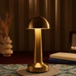 Neje Lighting | Domea Series: Signature Golden Ambiance & Cordless Portability Minimalist Domea gold touch lamp with a dome head emitting a warm 3000K glow, ideal for luxury dining and bedside decor.