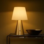 Neje Lighting | Aria : Sculptural Minimalism for Modern Luxury Interiors Close-up of Aria gold touch sensor lamp showing the high-fidelity pleated fabric shade and flicker-free warm white LED glow.