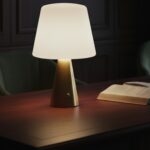 Neje Lighting | Aria : Sculptural Minimalism for Modern Luxury Interiors Close-up of Aria gold touch sensor lamp showing the high-fidelity pleated fabric shade and flicker-free warm white LED glow.