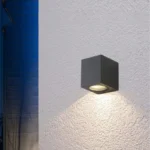 One-Way-Cube-Wall-Light-Modern-Black-Outdoor-2026 One Way Cube Wall Light: Modern black architectural exterior LED fixture for luxury Indian home facades.