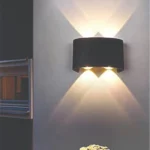 4 Way Curve Wall Light: Modern black 4-directional LED exterior lamp with IP65 waterproofing for luxury elevation lighting in India.