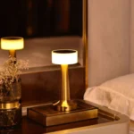 Helios Touch Lighting Lamp: Modern gold cordless table lamp with smart touch dimming and wellness-focused LED warm glow for luxury Indian bedrooms.