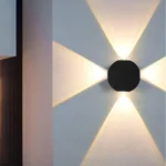 Round-Four-Way-Wall-Light-Symmetric-Architecture-2026 Round Four Way Wall Light: Modern black 4-way LED exterior fixture with IP65 waterproof rating for luxury elevation lighting in India.