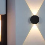 Round-Two-Way-Wall-Light-Symmetric-Elevation-2026 Round Two Way Wall Light: Modern black cylindrical exterior LED lamp with IP65 waterproofing for high-end Indian home facades.