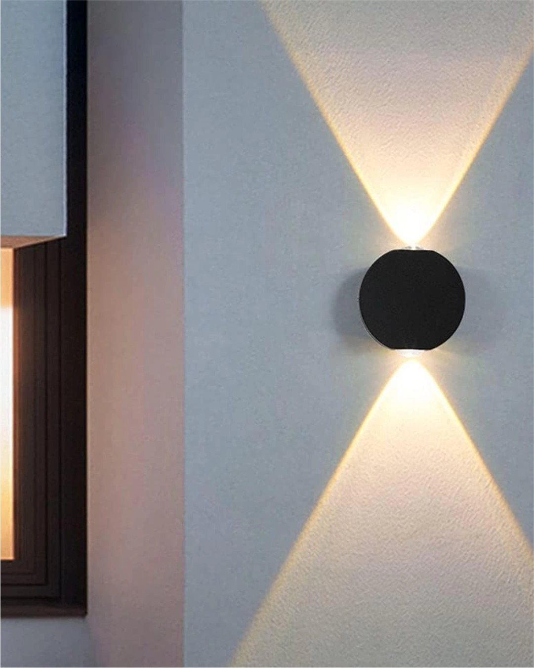 Round Two Way Wall Light: Modern black cylindrical exterior LED lamp with IP65 waterproofing for high-end Indian home facades.